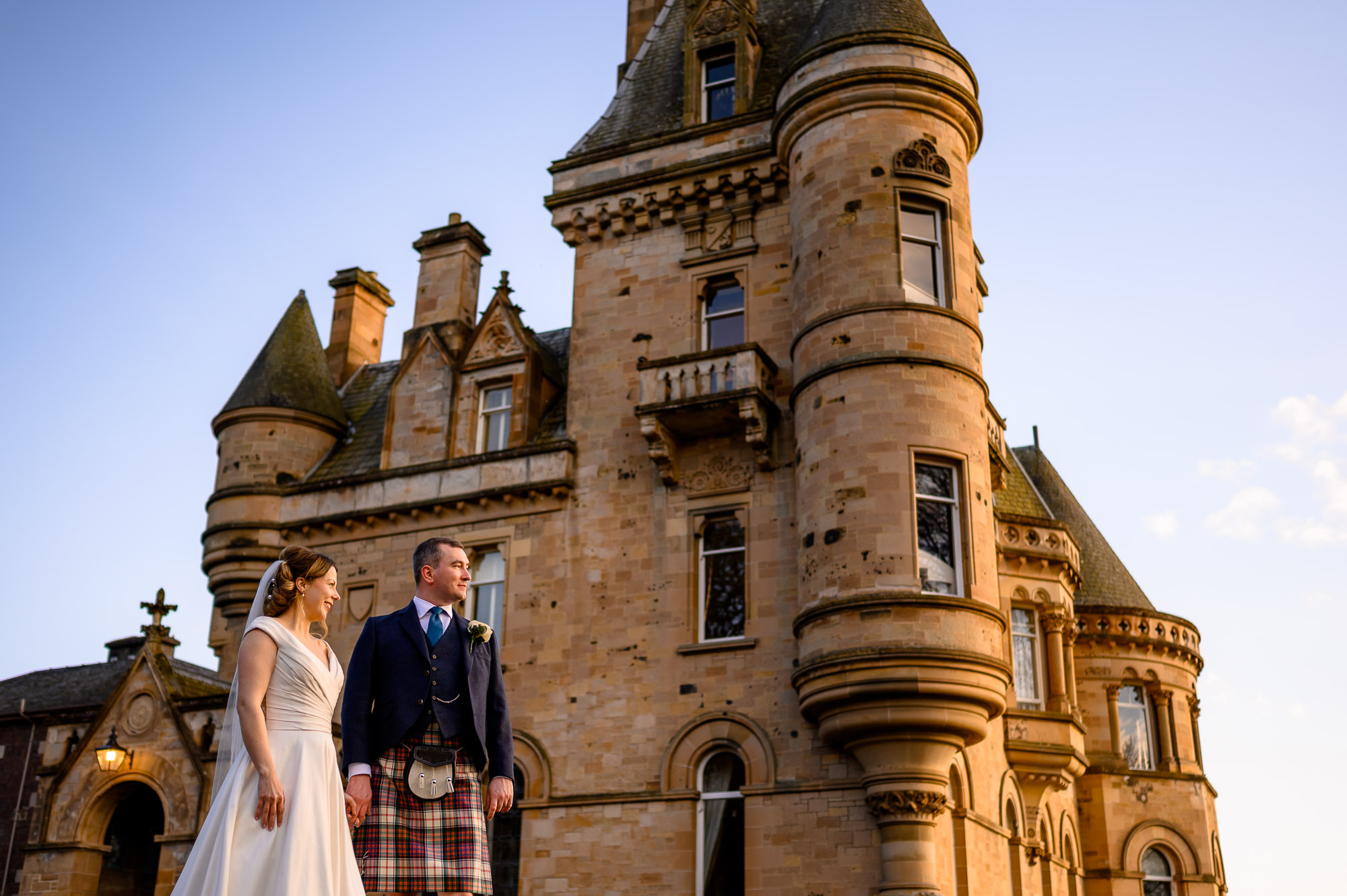 A wedding photographer capturing a ceremony at Cornhill Castle, reflecting the UK's strategic and cultural resilience.